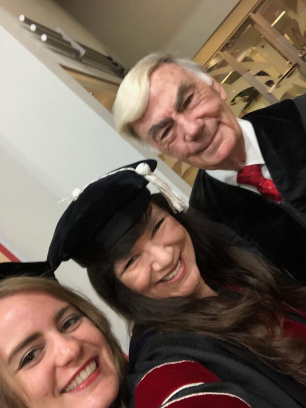 Kim-with-Sam-Donaldson-at-UNM-commencement-in-2019-Kim-is-VP-of-the-board-of-regents